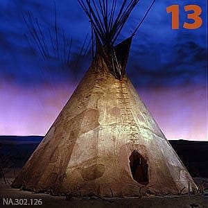 Authentic Nez Perce buffalo hide tipi from circa 1850, set against a dramatic twilight sky, highlighting its historical and cultural heritage.