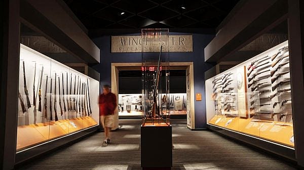 A visitor walks along the Cody Firearms Museum, a popular gun museum in Cody, WY.