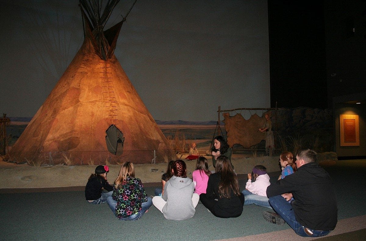 MILES students at hide tipi; Museum Experiences for Students