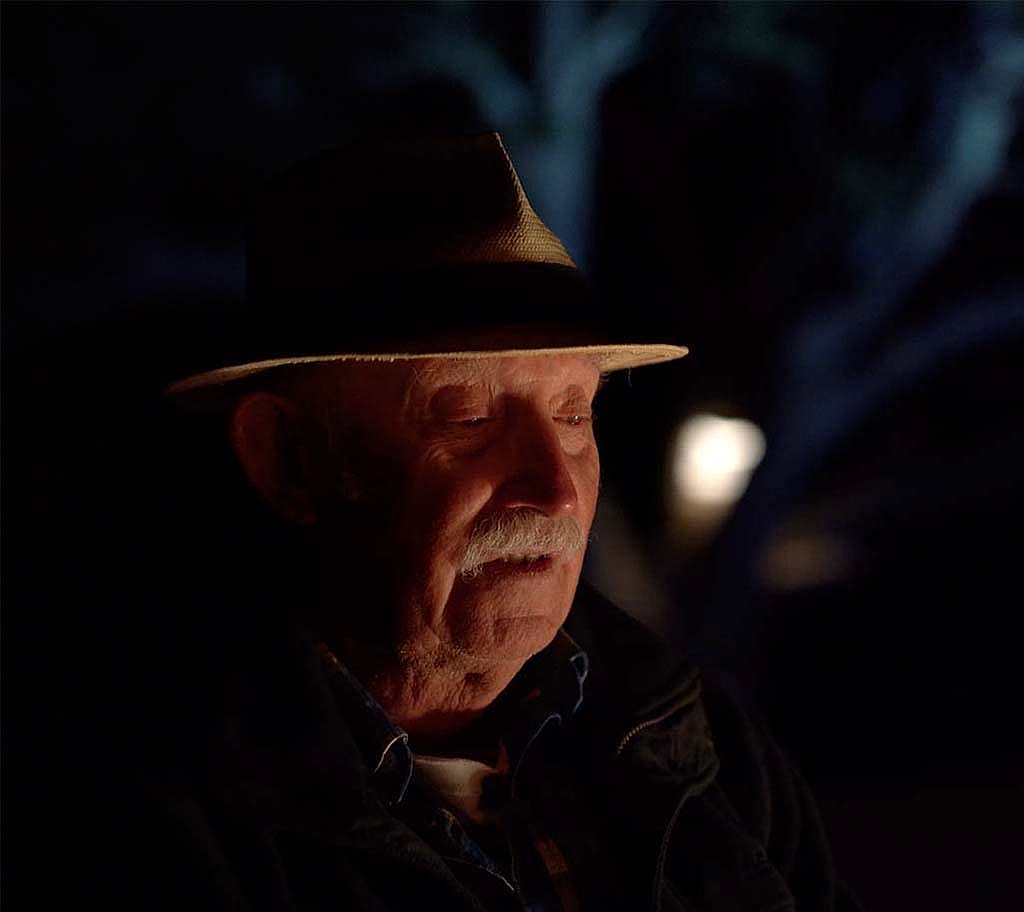 Artist Tony Foster discusses his hopes for the exhibition around the campfire at night. Photograph copyright TFJ LLC.