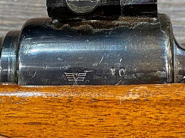 A detail from the manufacturer markings on a German 98k Mauser rifle made in the 1930s.